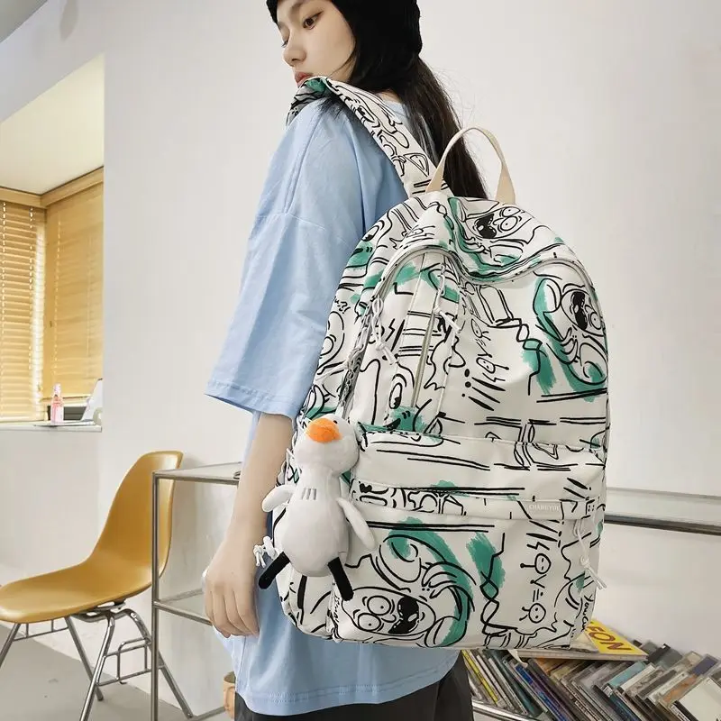 

Graffiti printed backpack female 2022 summer Korean fashion casual backpack male college schoolbag female travel shoulder bags
