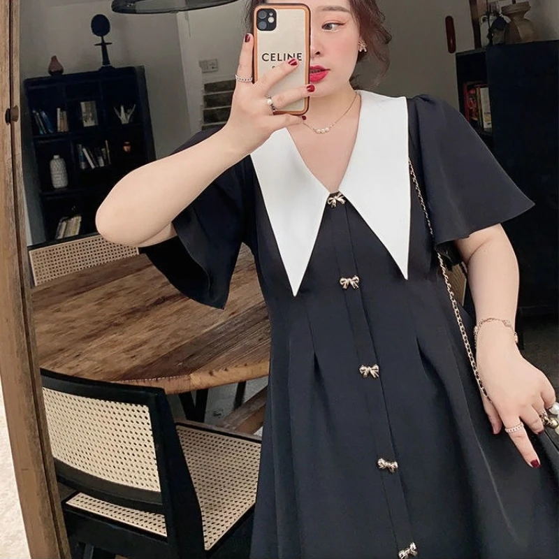 Женское платье с коротким рукавом и пуговицами