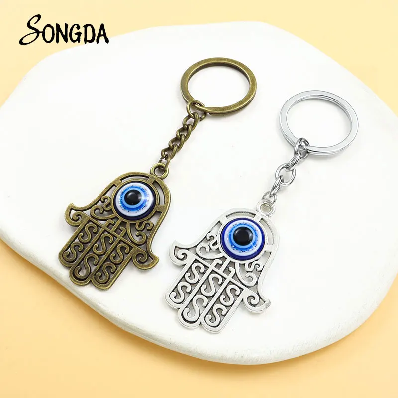 

Fashion Hamsa Hand Blue Turkish Evil Eye Alloy Pendant Keychain Fatima Hands Lucky Eyes Resin Keyring Car Bag Key Accessories