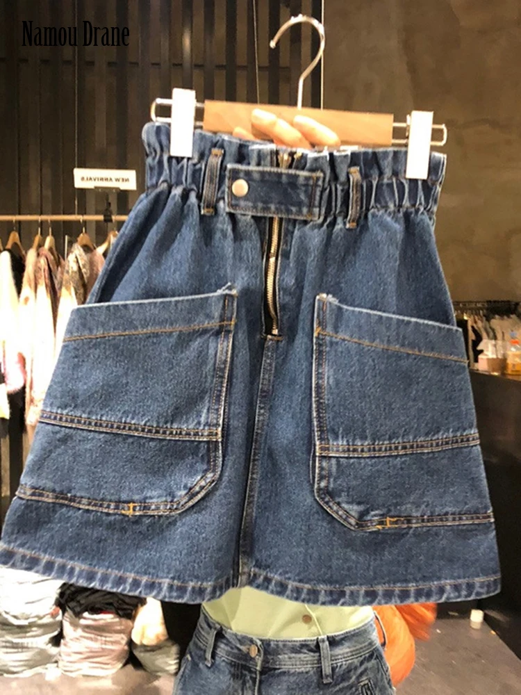 

Namou Drane Корейская версия весна-лето 2022 Новая эластичная юбка трапециевидной формы с высокой талией и большими карманами для женщин повсюду