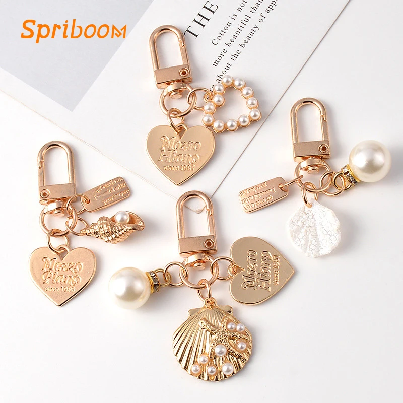 

Love Heart Shell Pearl Keychains Cute Gold Small Conch Pendant Keyring for Women Metal Word Caved Coin Earphone Case Accessories