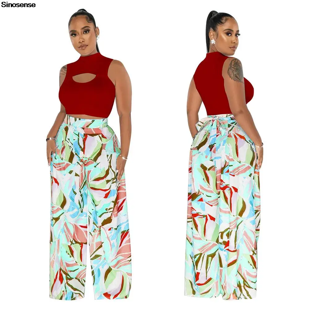 

Женский комплект из 2 предметов, укороченный топ без рукавов с круглым вырезом и вырезами, брюки с высокой талией и широкими штанинами, уличн...