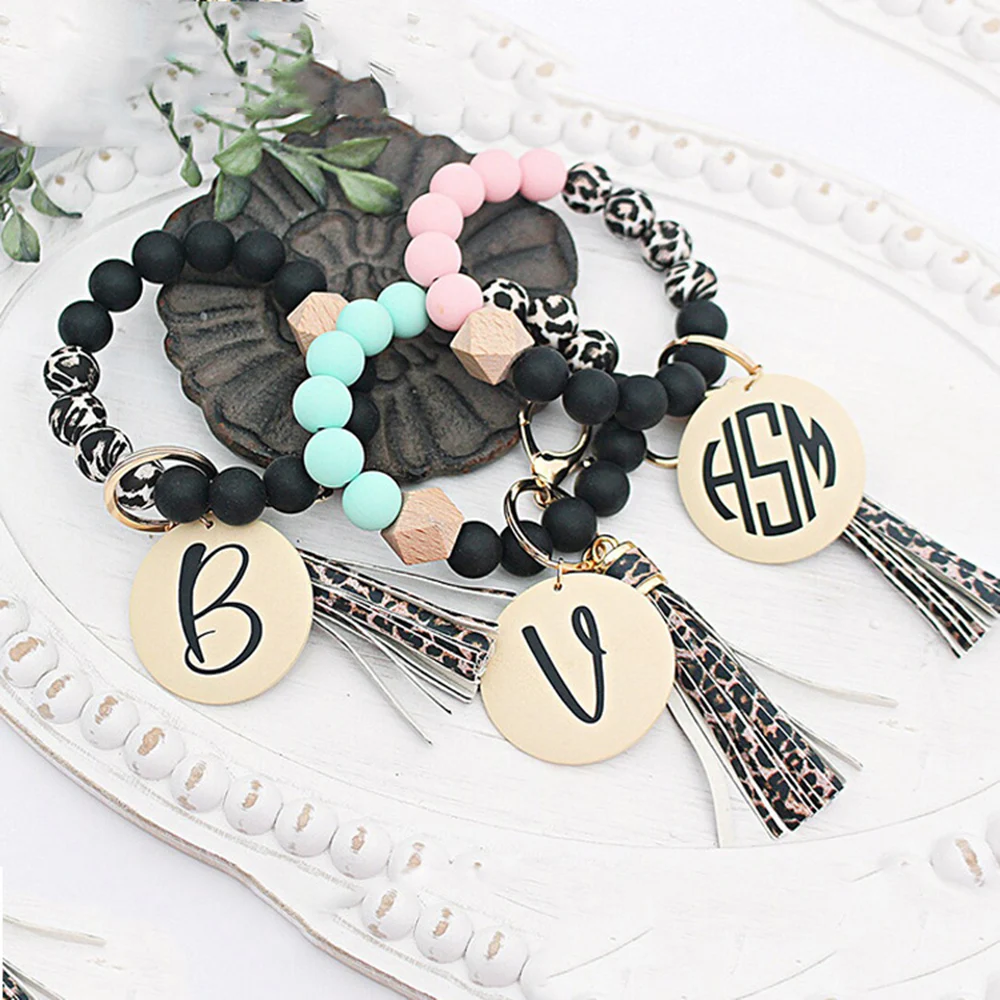 

Fashion Silicone Bead Bracelet Primary Wood Disk Bracelet Keychain Leopdard Tassel Wrist Elastic Cord Key Ring Charm Accessory