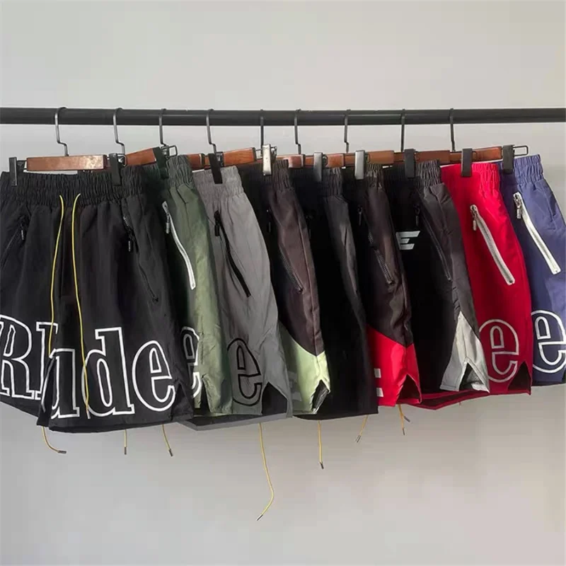 

Rhude 2023ss Shorts Men Women Cashew Oversize Breechcloth Basketball Yellow Drawstring Pill Zipper Head Clothing