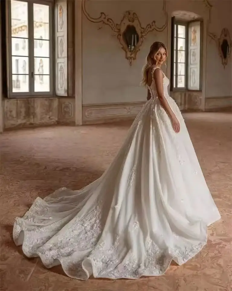 Фото Сексуальное свадебное платье А-силуэта с кружевными аппликациями, на тонких бретелях, из тюля, с открытой спиной, свадебные платья, индивидуальный пошив 2026 №4