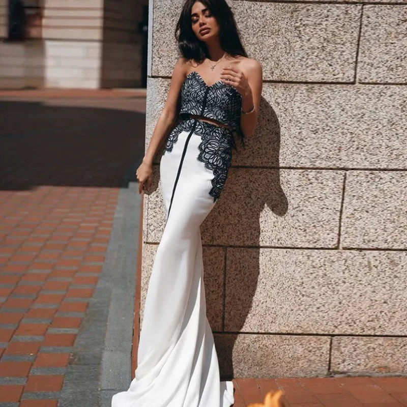 

Ladies two-piece suit 2021 high-quality black patchwork sexy thin shoulder strap short top + high waist long skirt slim suit