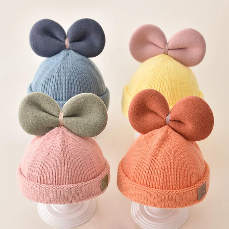 

Детская Вязаная Шапка-бини с большим бантом, осенне-зимняя плотная теплая шапка для мальчиков и девочек, детская пуловер, шапки для новорожд...