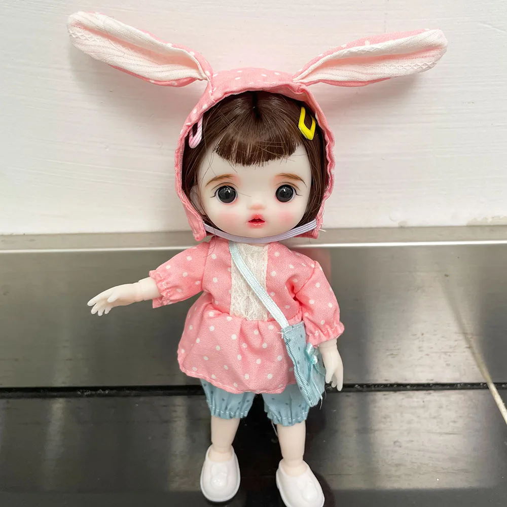 

1/8 BJD Doll 16cm Mini Girl with Clothes Hat Face Makeup Removable Wigs Kids Toys
