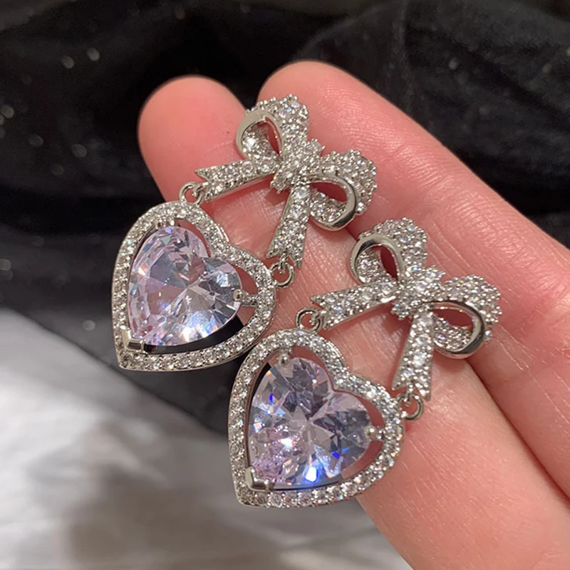 

Uilz Korean Temperament Retro Zircon Bow Drop Earrings Silver Color BowKnot Heart Shaped Crystal Earring for Women Party