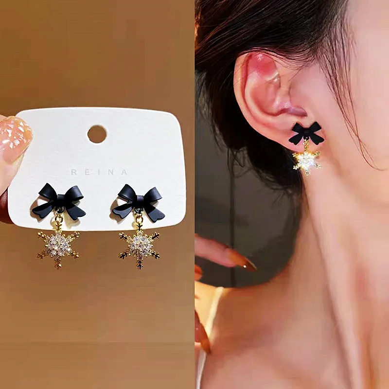 

S925 Silver pin Dongdaemen versatile bow-tie snowflake earrings Female design senior sense temperament personality stud