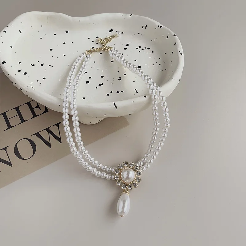 2023 Модное Новое ожерелье, оптовая продажа, простое роскошное Двухслойное жемчужное, элегантное и элегантное ожерелье до ключицы с геометрическим рисунком