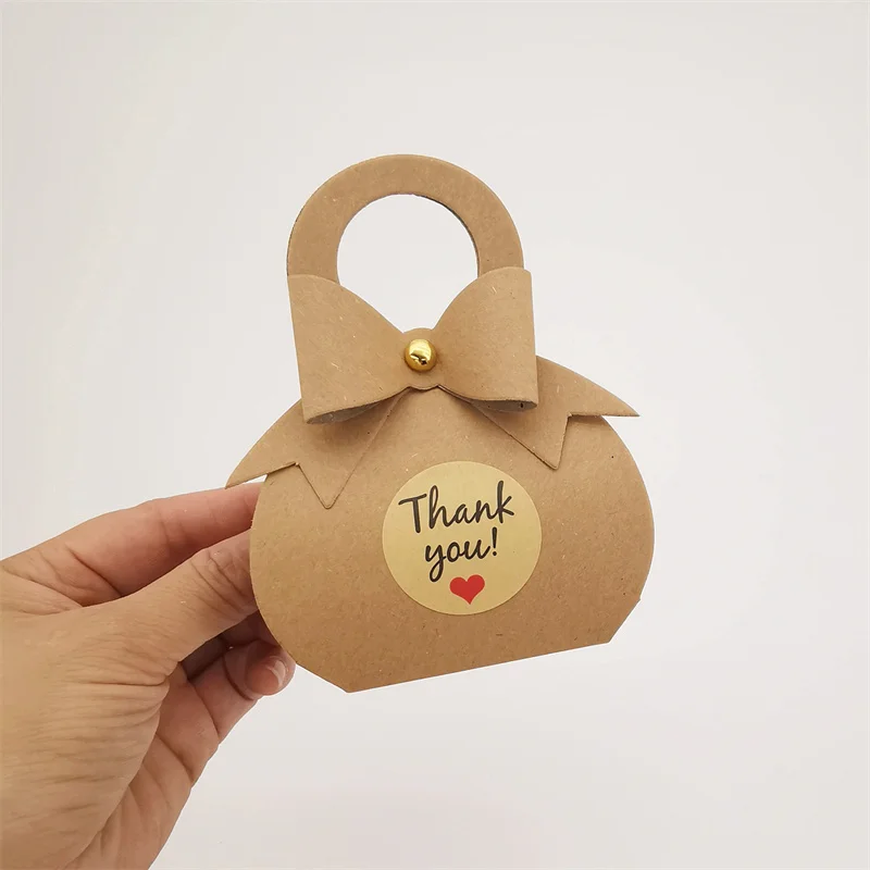 

50/100PCS Kraft Paper Bow Rivet Handle Gift Bag Sticker Wedding Birthday Candy Packaging Box Retro Hand Carrying Box Wholesale
