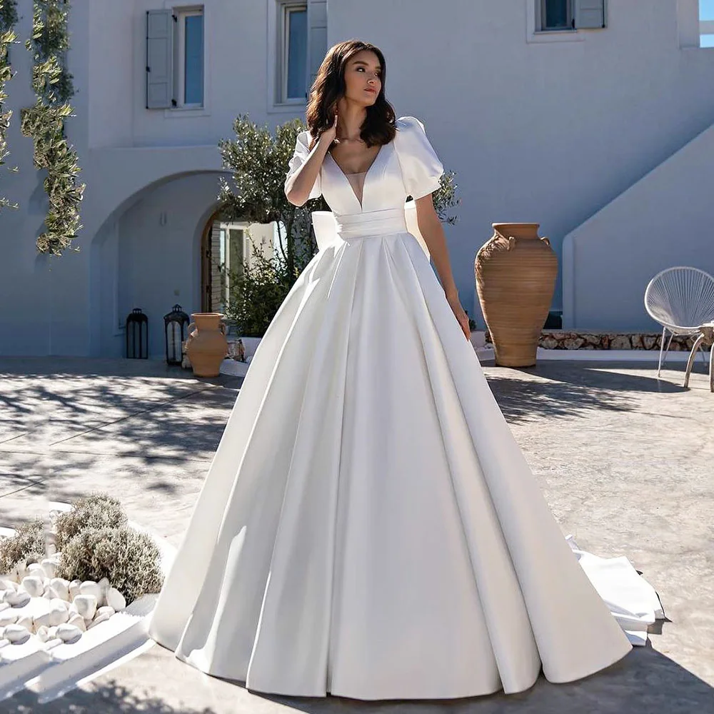 

Kejiadian White Satin Wedding Dresses With Pockets Short Sleeves Backless Bridal Dress Dubai Women Long Wedding Gown