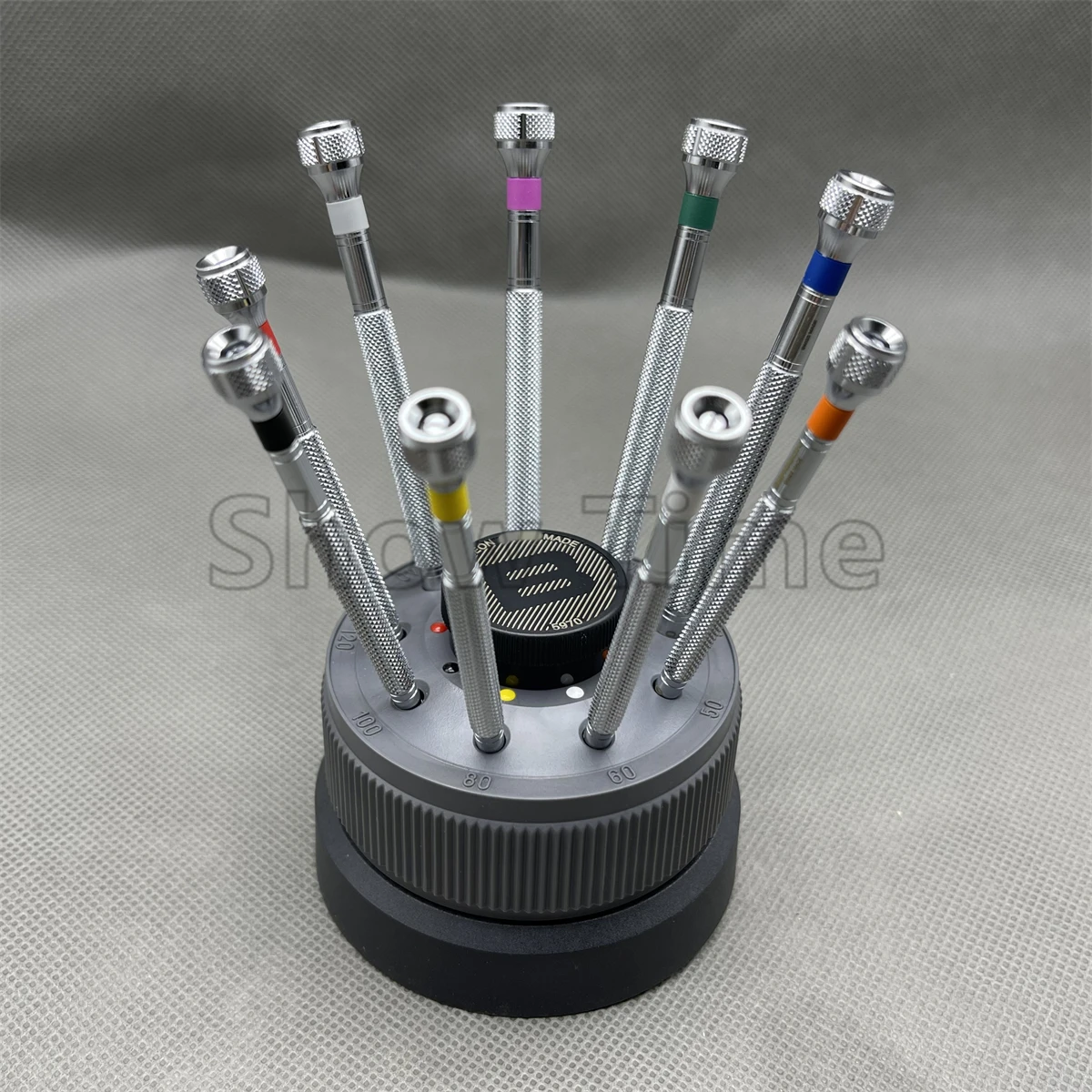 

Swiss Bergeon 5970 Rotating stand with 9 stainless steell screwdrivers with colured slots for spare blades watchmaker