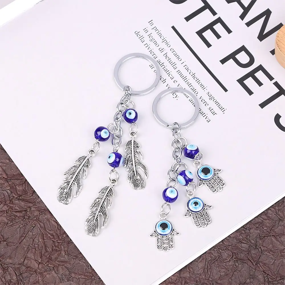 

1 PC Turkish Demon Eye Key Chains Lucky Blue Eye Fatima Hand Key Ring Charm Trinket Vintage Men Women Car Key Pendant