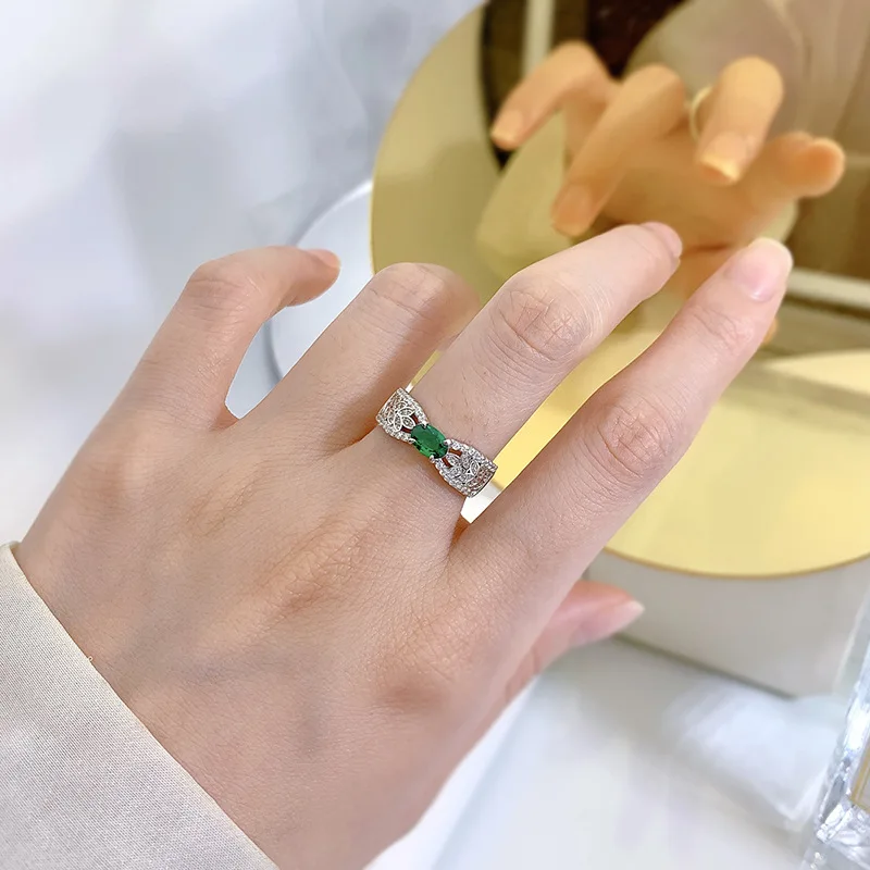 

Jewelry Sterling Silver Wheat Ear Hollow Ribbon 4 * 6 Emerald Ring Female Minority Design Light Luxury 3D Ins