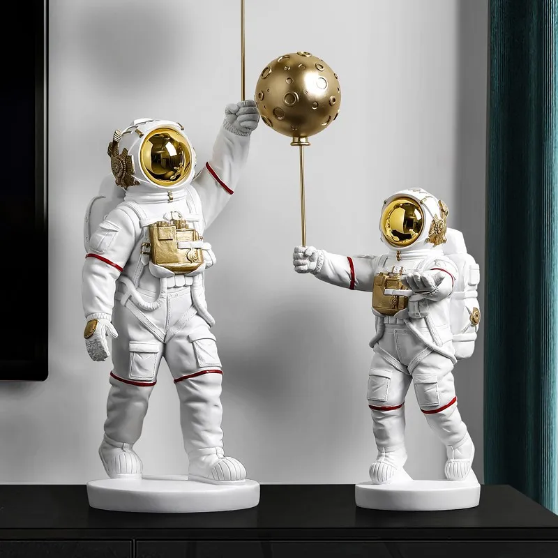 

Resin Spaceman Sculpture Lifting Ball Astronaut Ornaments Living Room Home Office Desktop Decorations Nordic Style Creative Gift