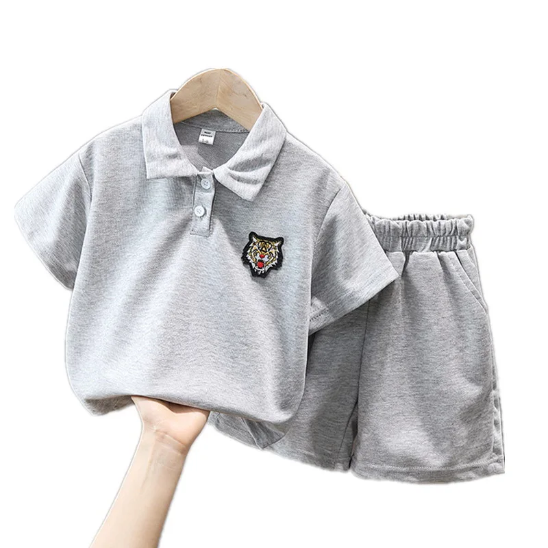 

Костюм детский летний из рубашки-поло с коротким рукавом и брюк