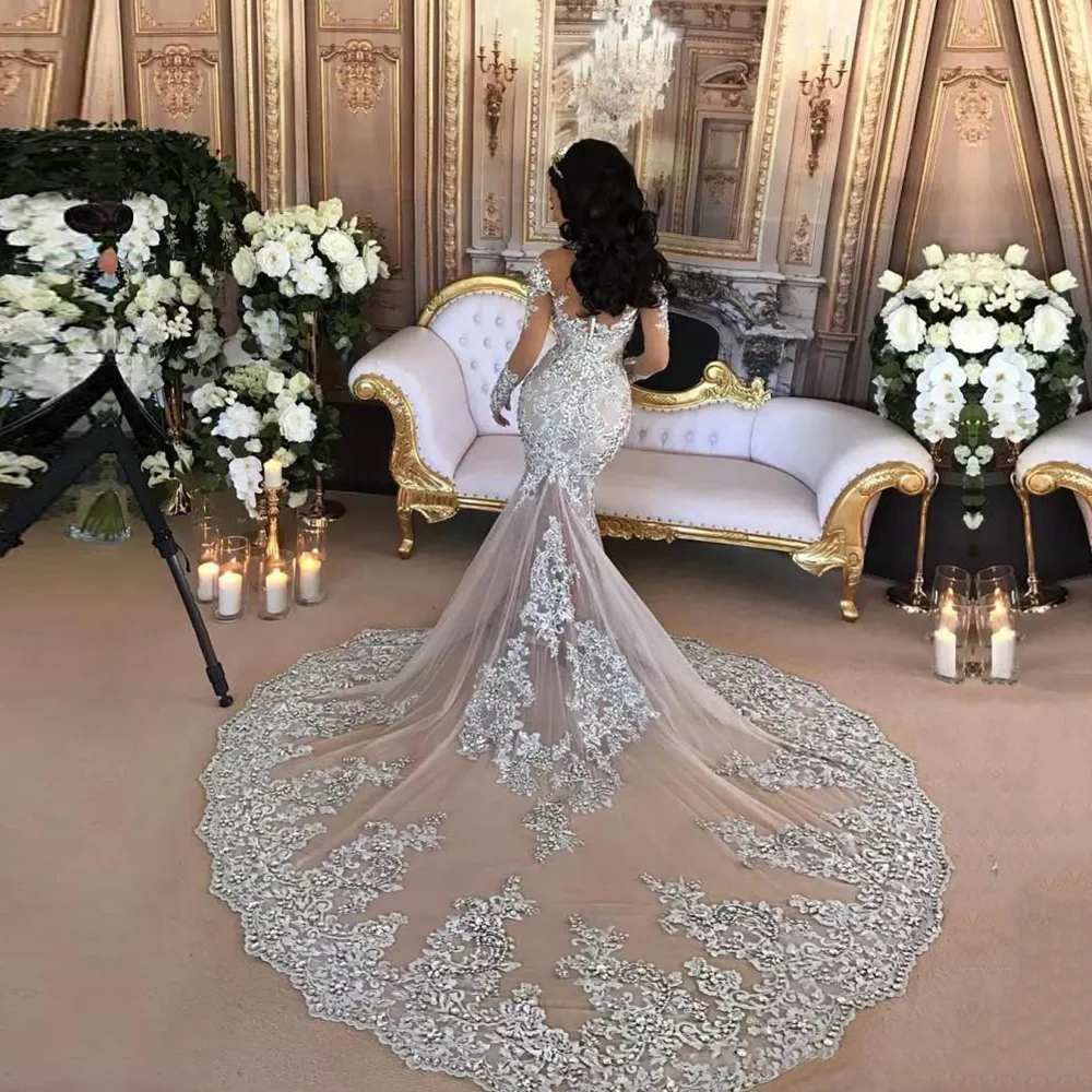 

2022 Dubai Arabic Luxury Sparkly Wedding Dresses Sexy Bling Beaded Lace Applique High Neck Illusion Long Sleeves Mermaid Dress