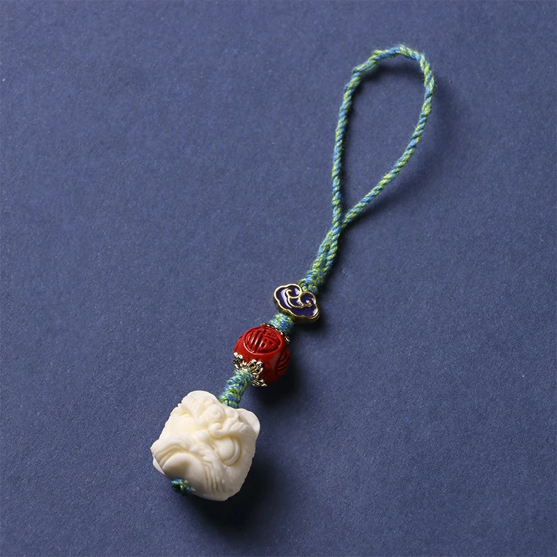 Брелок с подвеской в виде фрукта слоновой кости и льва