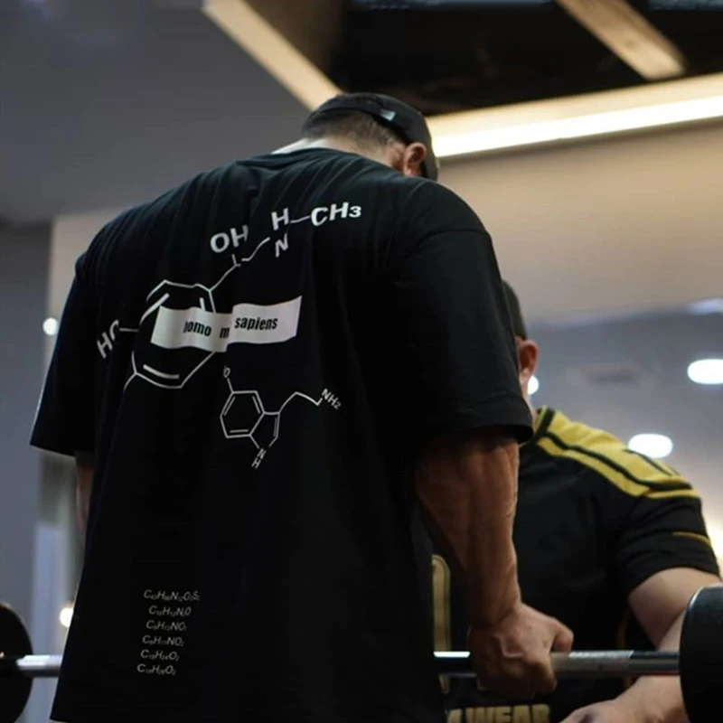 

Ropa de moda para hombre, camiseta elástica de manga corta holgada de gran tamaño para fitness, gimnasio, culturismo, novedad de