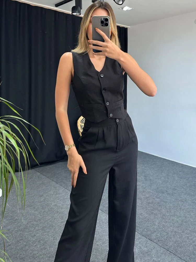 Женский брючный костюм из двух предметов элегантный офисный зеленого цвета с