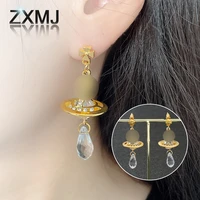 zxmj viviane saturn earrings hip hop diamond earrings for women fashion ear stud small golden ball pendant earring jewelry
