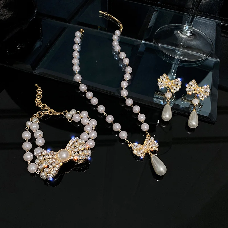 

Fashion Bridal Jewelry Pearl Bow Earrings Temperament Design Earrings Necklace Bracelet Set Luxury Accessories for Woman