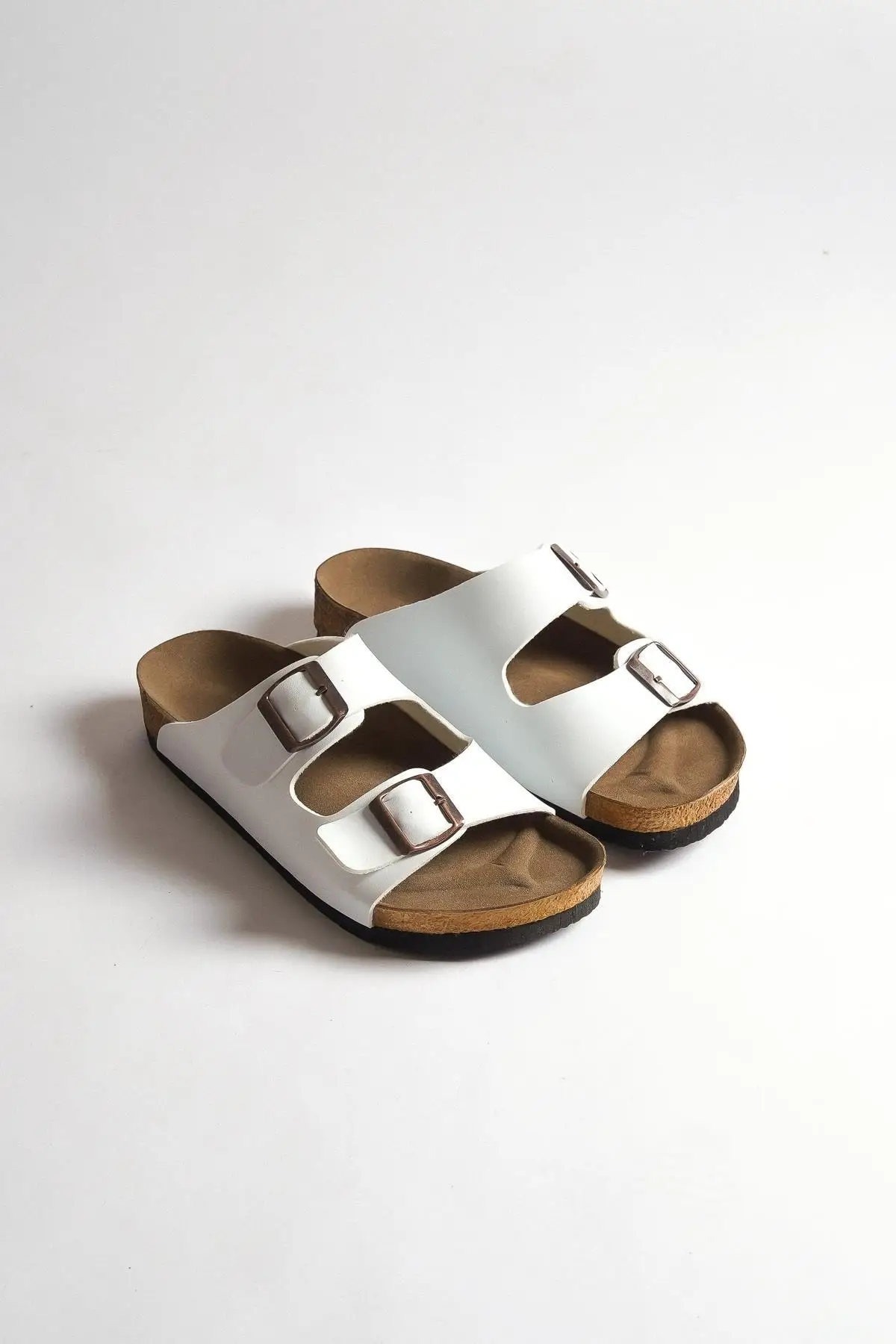 

Women white double buckle skin slippers
