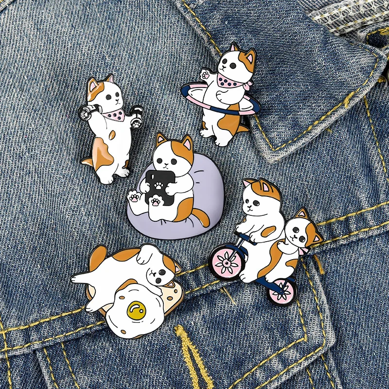 

Fun Cat Enamel Pin Custom Animal Cycling Dumbbell Play Games Brooch Denim Bag Lapel Badge Fashion Jewelry Gifts for Friends Kids