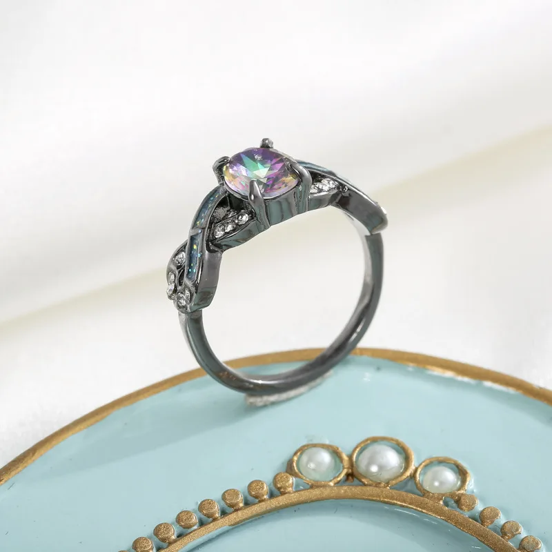 

Черное золото, белый циркон, искусственный синий опал, красочное женское кольцо