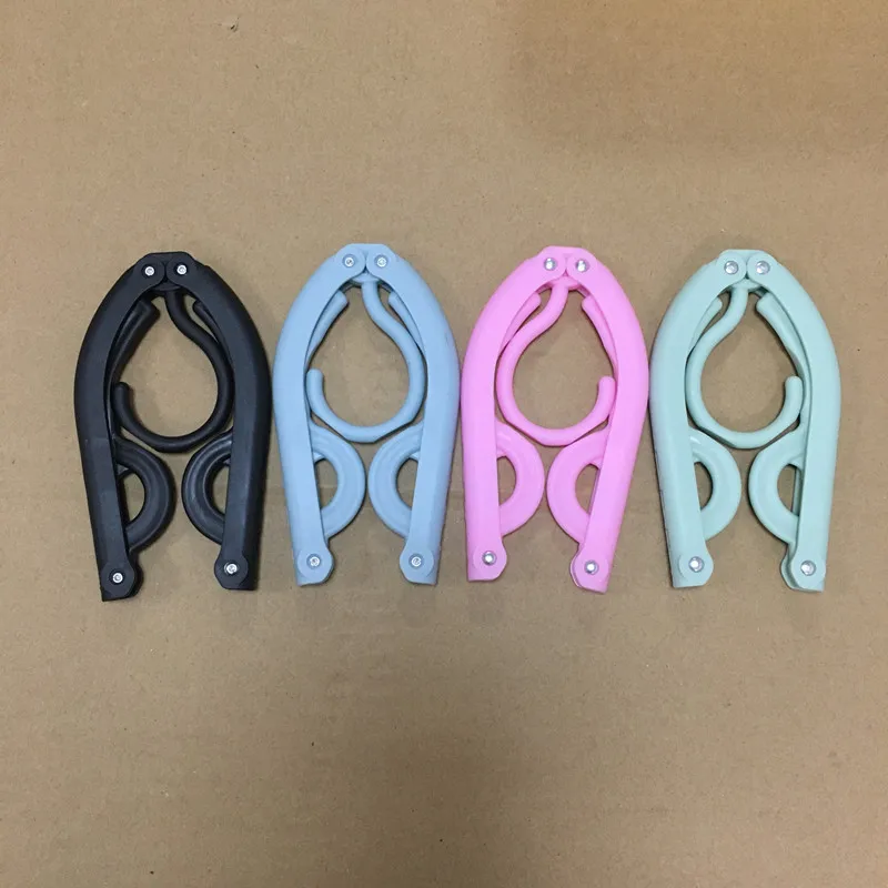 

2022 thickened household multifunctional travel folding hanger portable magic plastic student hangerhang garment lever