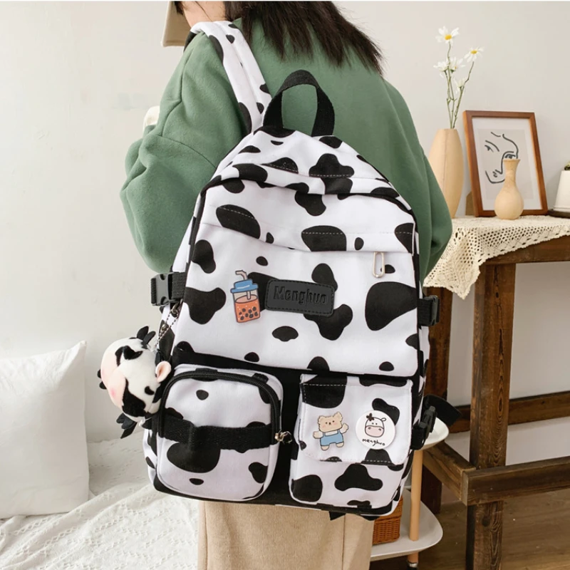 

Dropshipping milk cow pattern backpack 2022 students school bag large capacity travel leisure backpacks for women