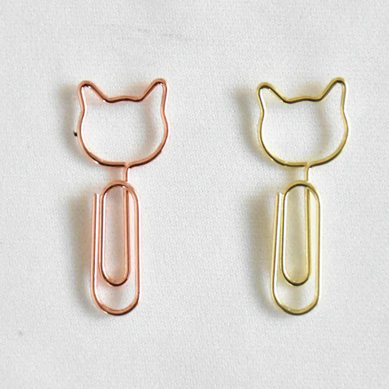 

Металлические скрепки-кролики золотого цвета