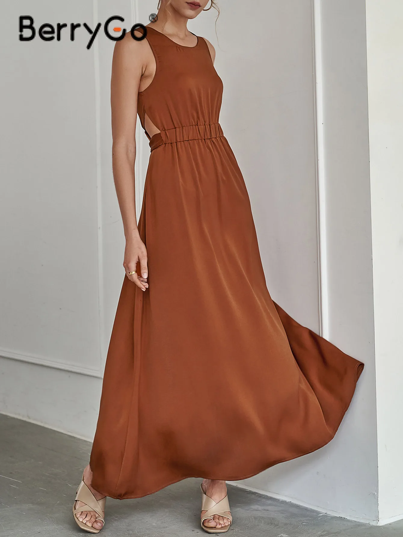 

BerryGo Elegant sleeveless O-neck hollow out belt A-line dress women Fashion belt elastic waist maxi dress 2022 Summer vestidos