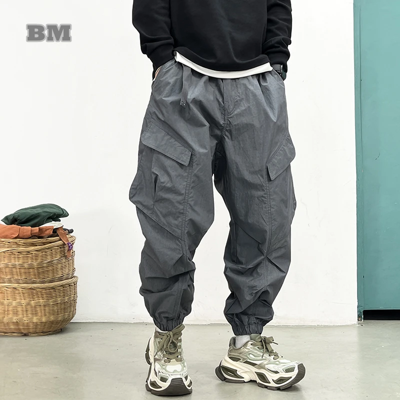 Фото Корейские брюки-карго Techwear, мужские весенне-летние быстросохнущие легкие уличные брюки, повседневные свободные зауженные брюки для бега, модные хип-хоп №1
