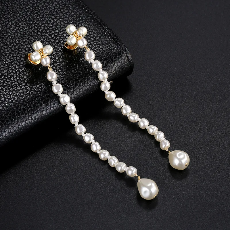 

Европейская и американская искусственная кожа с нестандартными жемчужными кисточками