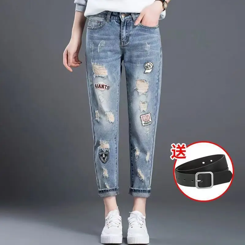Spring and summer new Korean style pierced jeans female students loose large slim fit versatile cropped pants Harlan pants