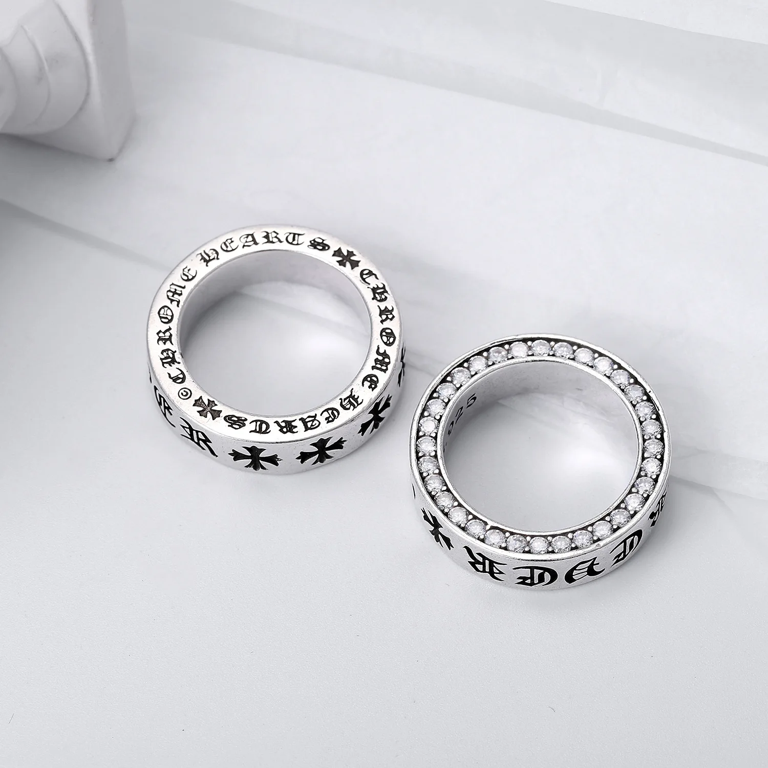 

letter cross male and female student couple ring