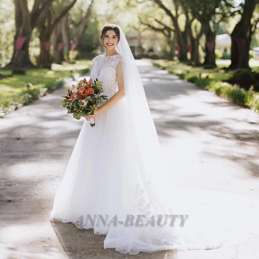 

Anna O Neck A Line Wedding Dress New Classic Sleeveless Pleats Court Train Stylish Backless Tulle Robe De Mariée Made To Order