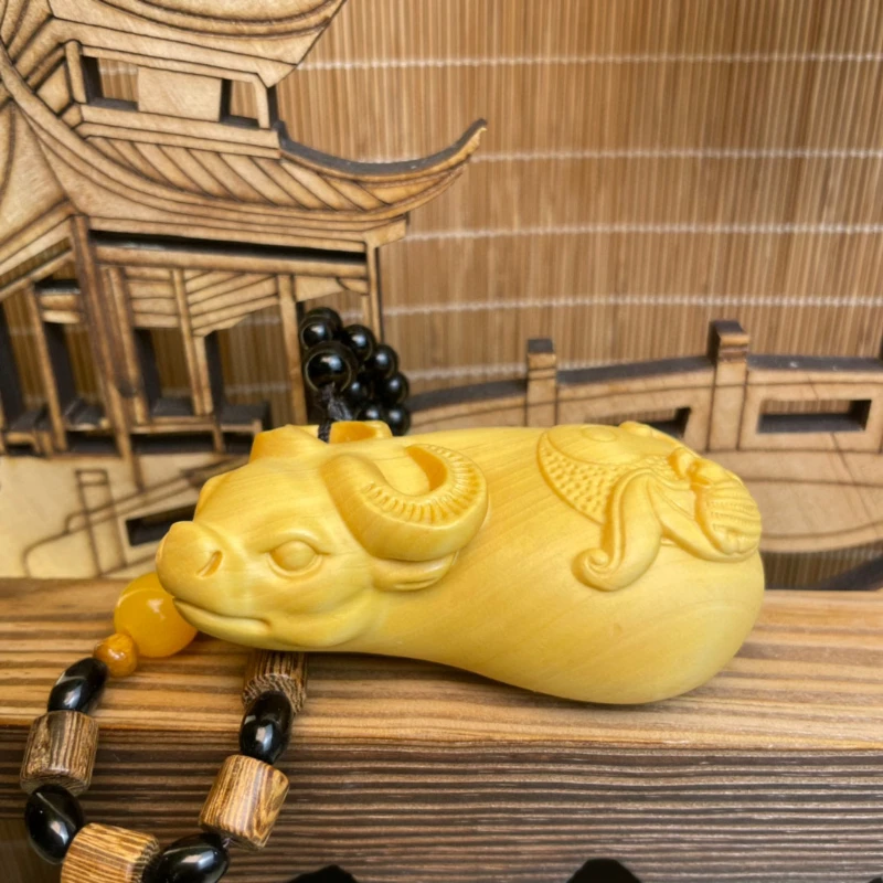 

Boxwood animal ox turn Qiankun Hongfu auspicious hand pendant text play solid wood carving with play piece home decor