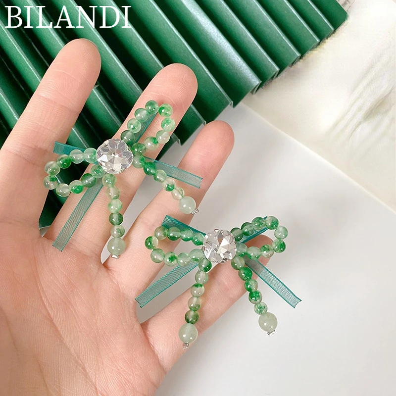 

Bilandi Trendy Jewelry Bowknot Earrings 2022 New Trend Spring Style Glass Fairy Green Beads Earrings For Women Female Gifts