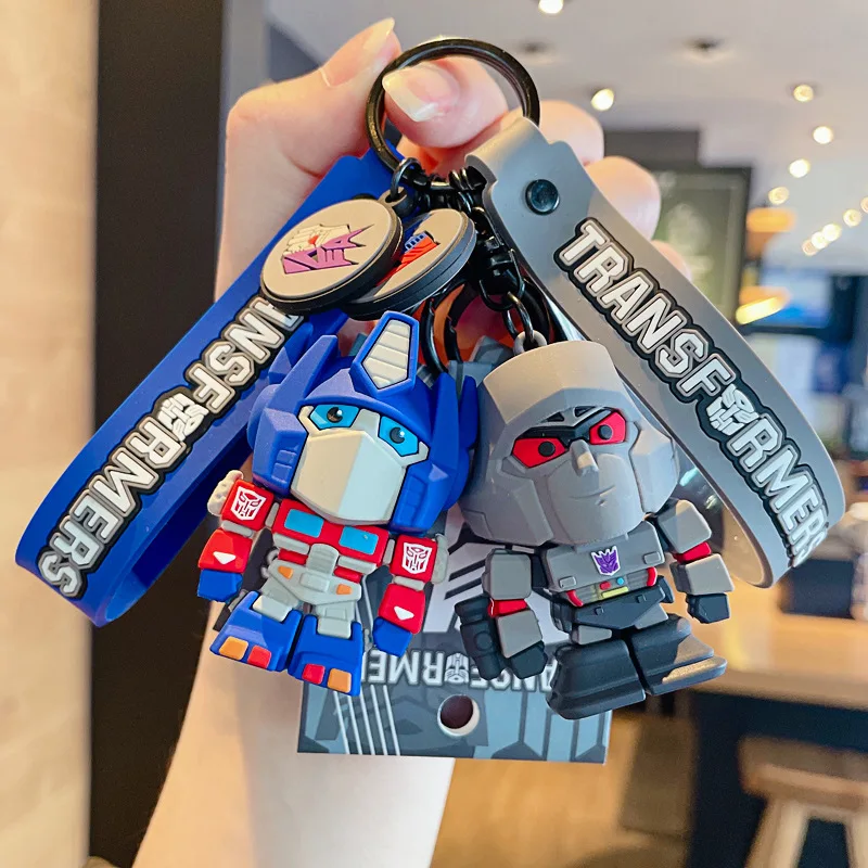 

Optimus Prime Bumblebee Decepticons Keychain Cartoon The Transformers Keyring Couple Bag Ornament Key Chain Car Pendant Gift