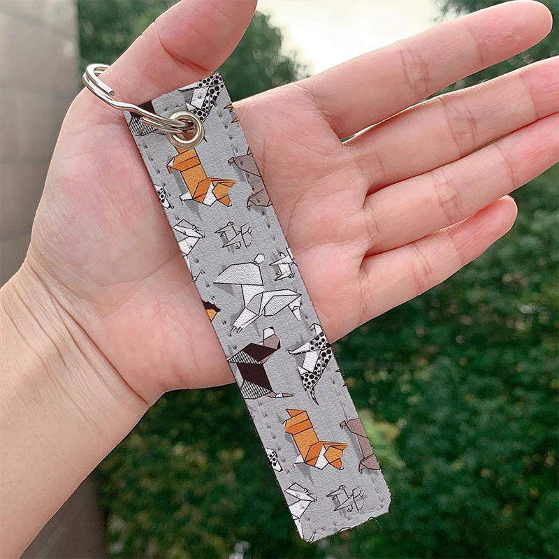 

Origami doggie friends grey linen texture background Leather Keychain Strap Keyrings Holder Bag Car Wallet Trinket Hanging
