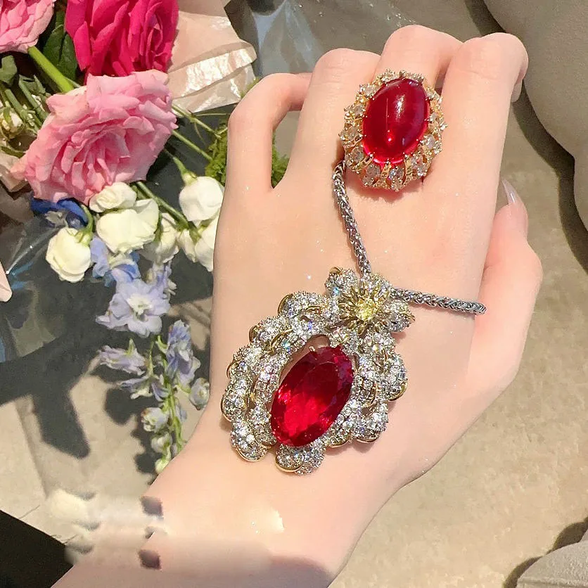 

Women Sotheby's Pigeon Blood Jacinth Fireworks Necklace 18K Gold Plated Garnet Red Egg Zircon Ring