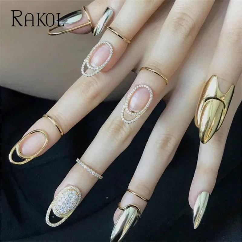 

RAKOL Fingertip Nail Shiny Armor Rings for Women New Cubic Zirconia Hollow Metal Fashion Jewelry Party Gifts Accessories