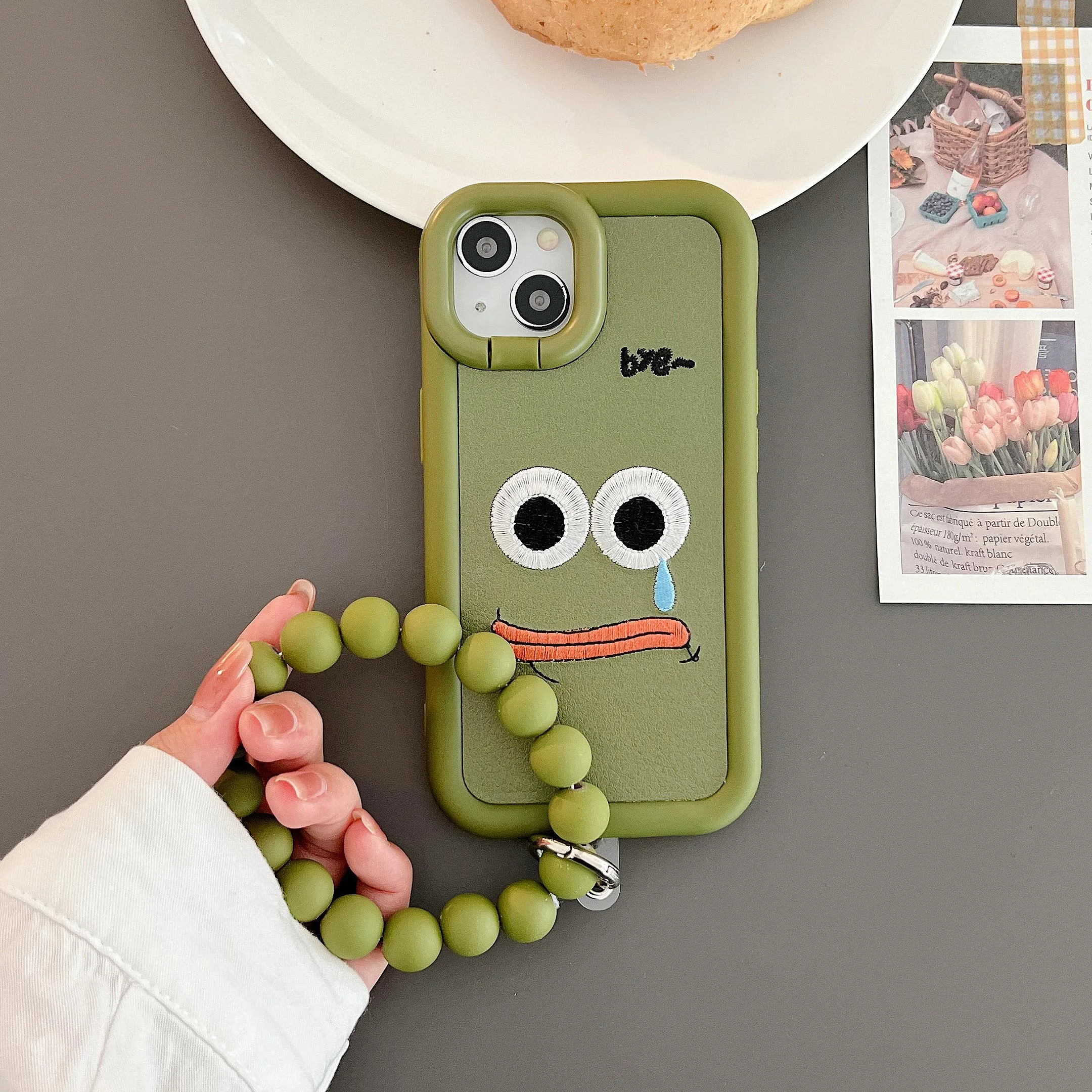 

A Wailing Face Holder Bracelet Case for iPhone 14 13 12 11 Plus Pro Max XR Lens Frame Stand iPhone14 Protection Bumper Cover INS