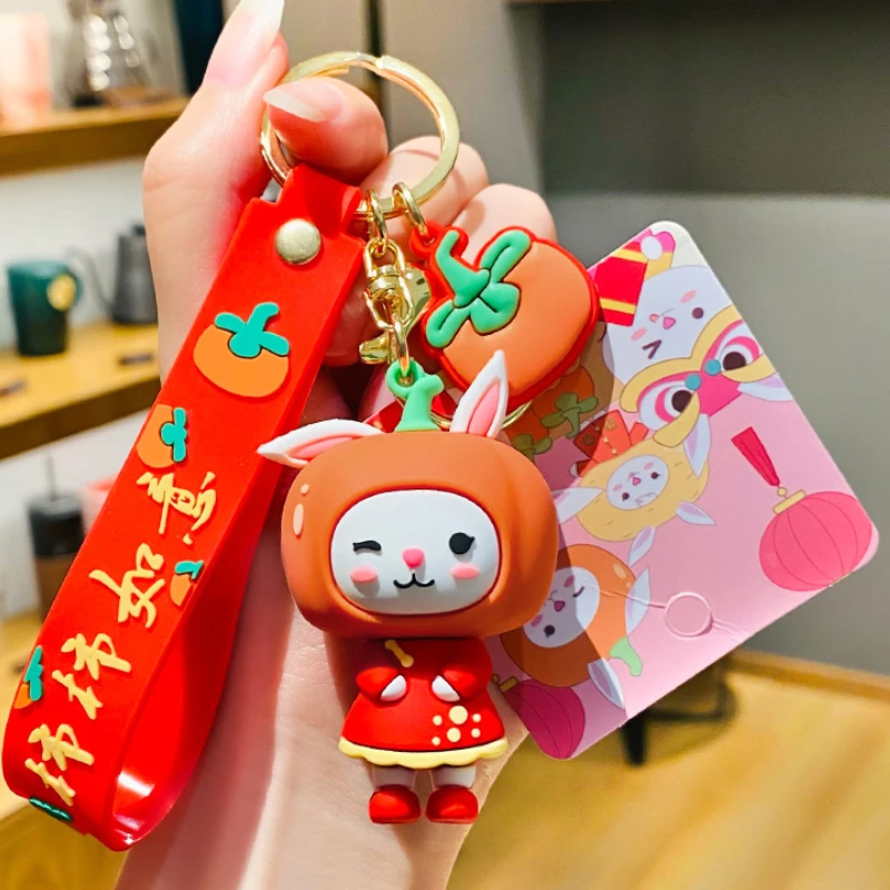 

Creative Country Tide Tang Suit Rabbit Year 2023 New Year Keychain Charm Cute Persimmon Ruyi Bag Accessories Gift Wholesale