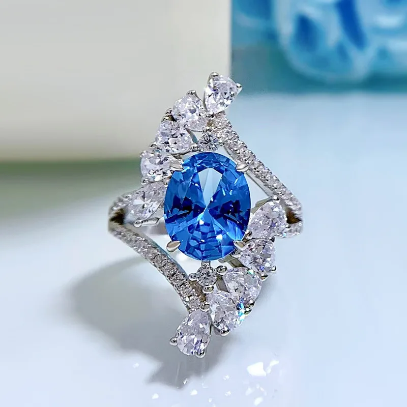 

2022 New 925 Silver Imported High Carbon Diamond Ring Female 8*10 Oval Topaz Blue Hao Setting Ring