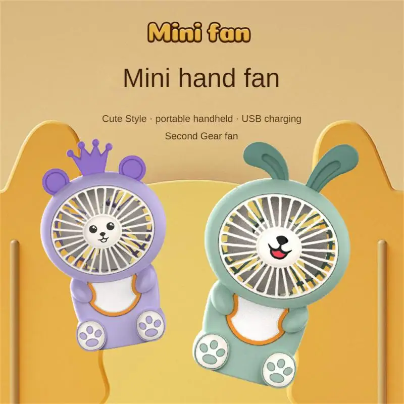 

Маленький и удобный зеленый ночной светящийся мини-вентилятор, фиолетовый мини-электрический вентилятор, ручной мультяшный маленький вентилятор 2023